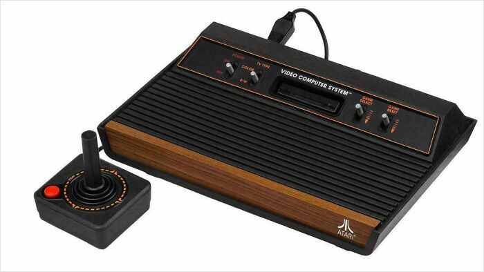 Retro Atari console with joystick, a nostalgic item from the past that makes you feel old.