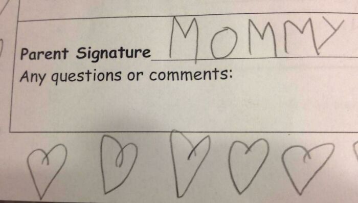 Child writes "Mommy" in parent signature section, surrounded by drawn hearts, capturing a light-hearted moment.