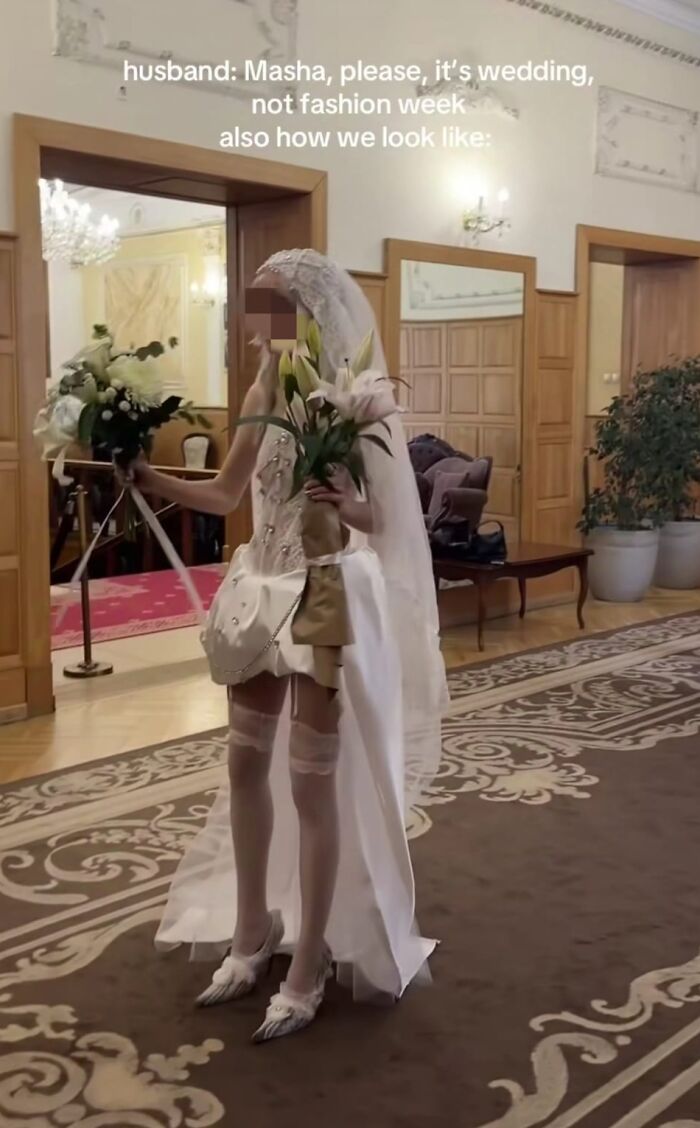 Bride in eclectic wedding outfit featuring a mini dress, veil, and knee-high stockings, showcasing a fashion crime.