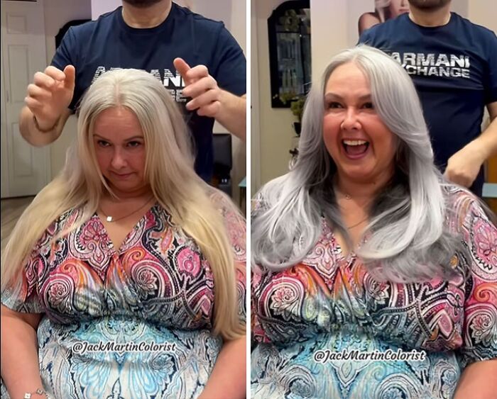Woman joyfully showcasing natural gray hair transformation at a salon, highlighting her vibrant style.