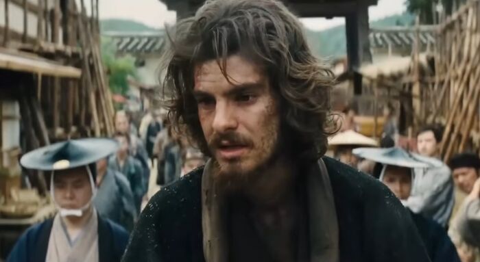 Actor immersed in a difficult role with period costume and makeup, showcasing dedication to challenging acting roles.