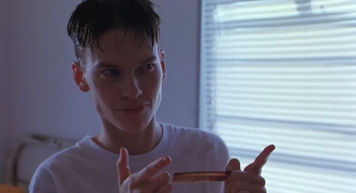 Actor in a dramatic scene, holding a comb, showcasing dedication in challenging roles for difficult acting moments.