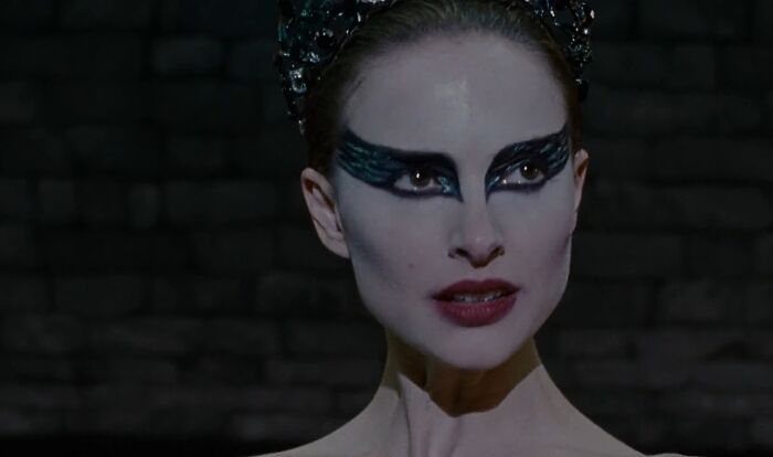 Actress with dramatic black and white makeup portraying a challenging role, showcasing dedication of actors to difficult roles.