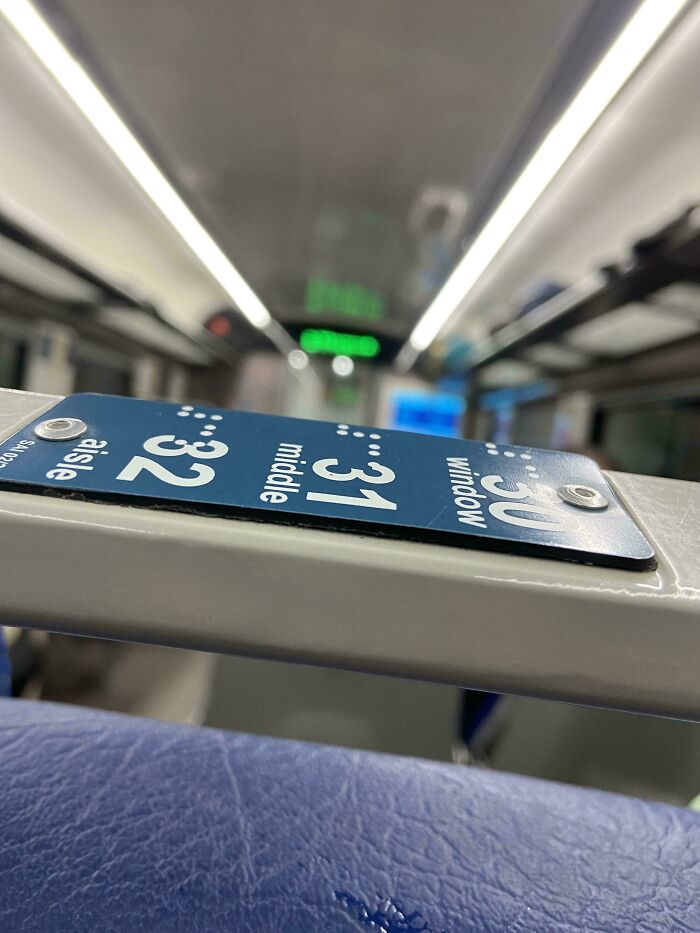 Misaligned seating numbers on public transport, illustrating city planning oversight.