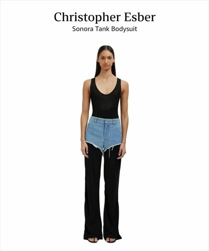 Model wearing a Christopher Esber bodysuit with denim shorts over black pants, exemplifying questionable fashion design.