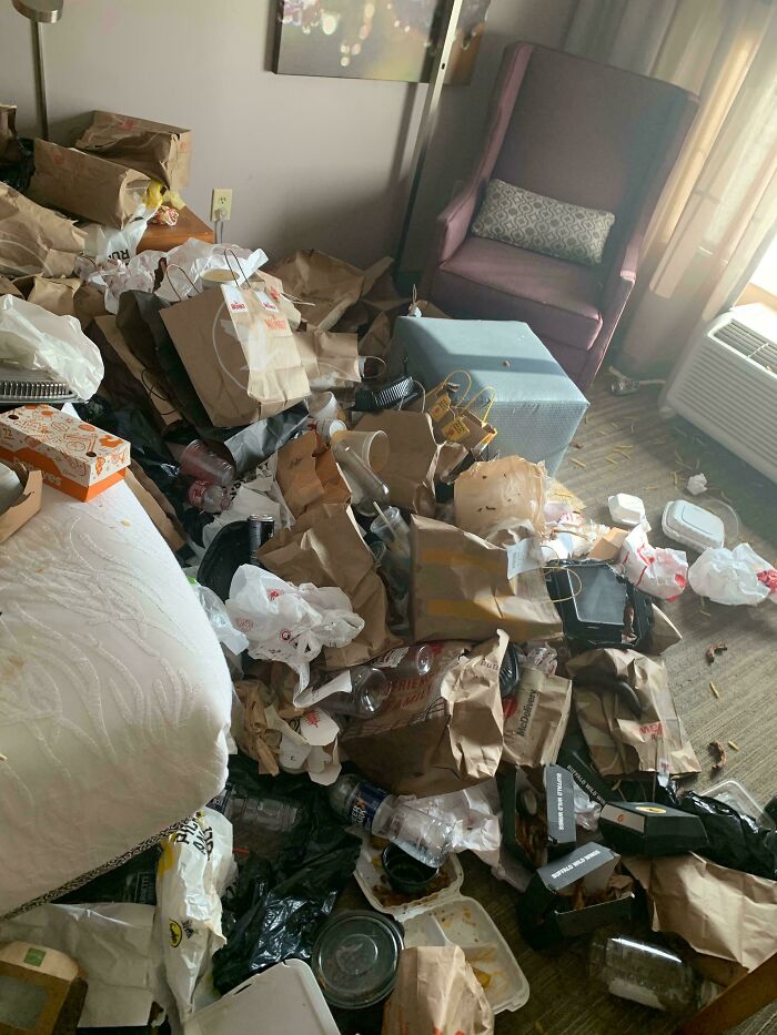 Room filled with trash, showcasing lack of basic etiquette in housekeeping.