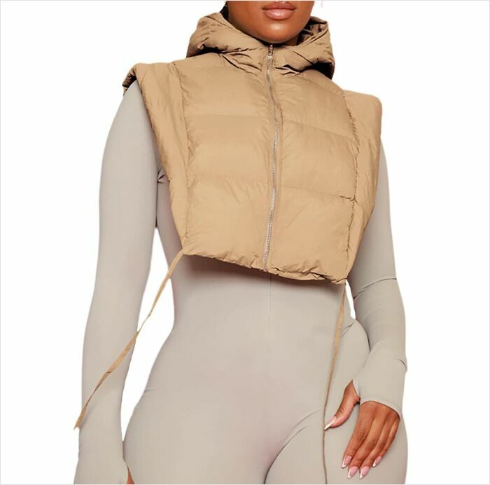 Fashion crime: model in tan cropped vest over beige bodysuit.