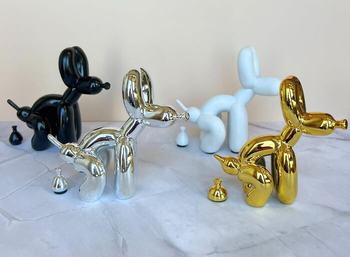 Colorful balloon dog sculptures enhance apartment decor.