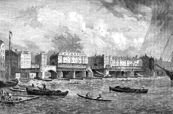 Historic architectural wonders by the river with boats and bridge, showcasing lesser-known design marvels.