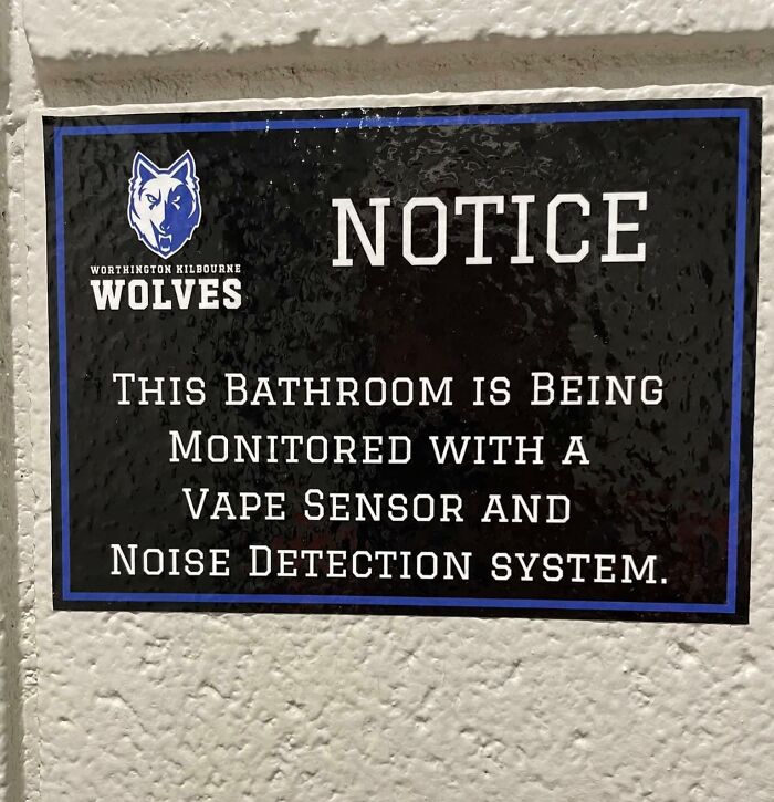 Sign in school bathroom with vape sensor and noise detection notice.