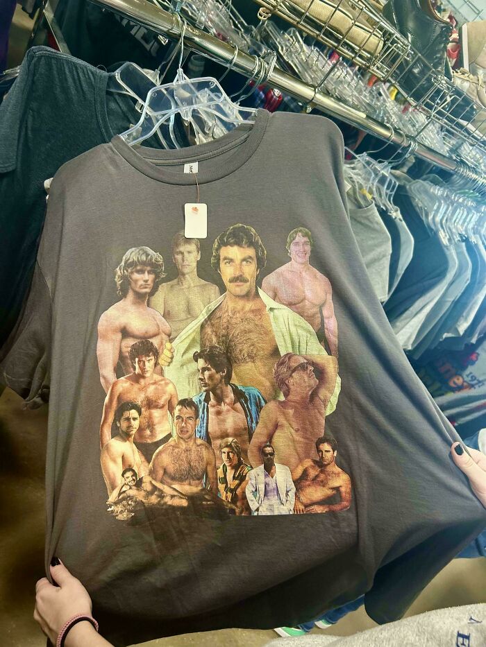 Goodwill find: unique shirt featuring a collage of a mustached man's portraits in various poses, held up in a store.