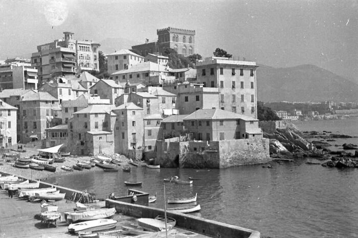 Black and white photo of a European coastal village showing what life in Europe looked like 100 years ago.