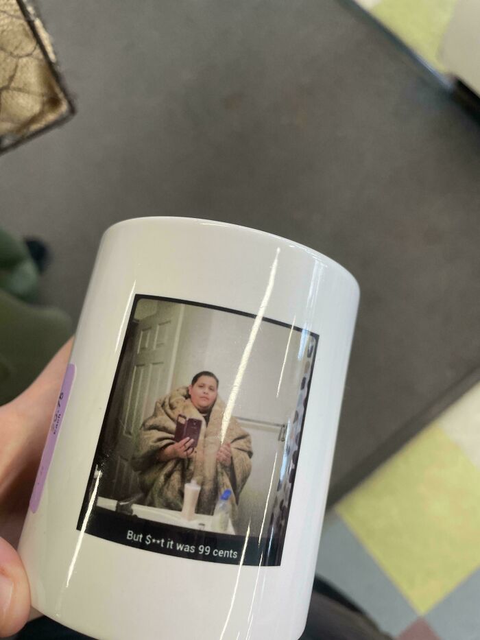 A mug featuring a selfie of a person in a fur coat with text reading, "But S**t it was 99 cents," a hidden gem from Goodwill.