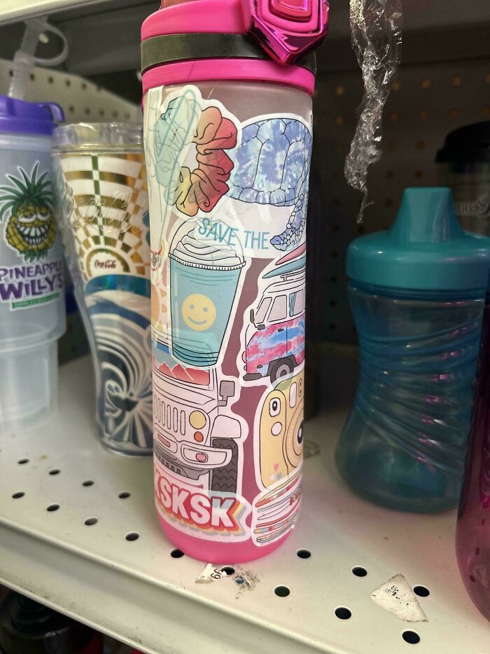 Goodwill find: colorful water bottle with quirky stickers on a store shelf.