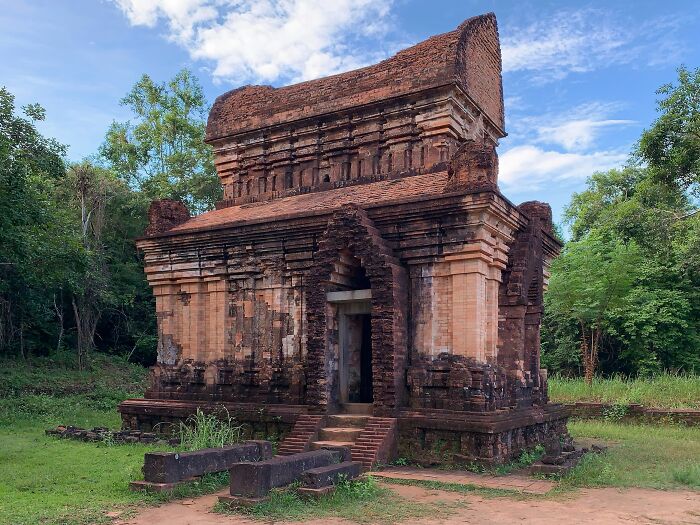 Ancient brick temple surrounded by trees, showcasing one of the architectural wonders not well-known.