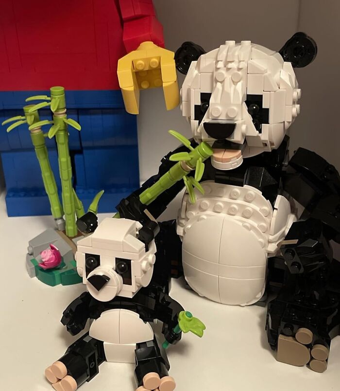 Lego panda bears sitting with bamboo, featured in a new Bored Panda children's book.