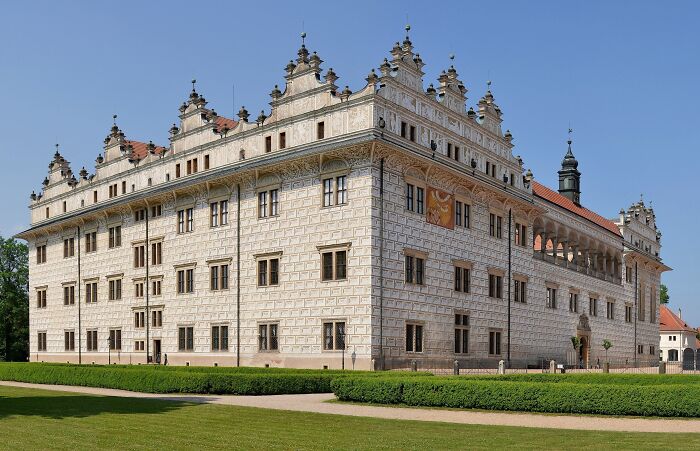 A lesser-known architectural wonder with ornate facades and intricate details under a clear blue sky.