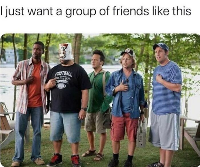 Five men standing outdoors, one wearing a bucket on his head, humor about men and friendship.