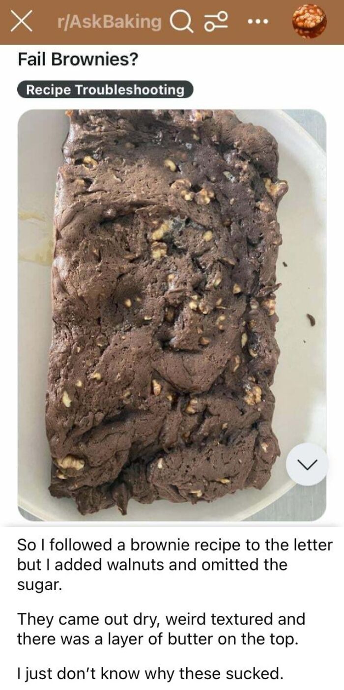 Dry and c*****d brownies with walnuts, missing sugar, a result of not following the recipe correctly.