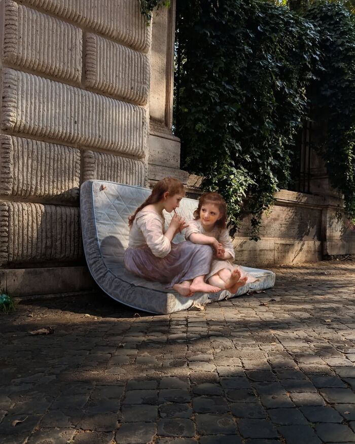 Classical figures on a modern street, sitting on an old mattress, combining past and present.