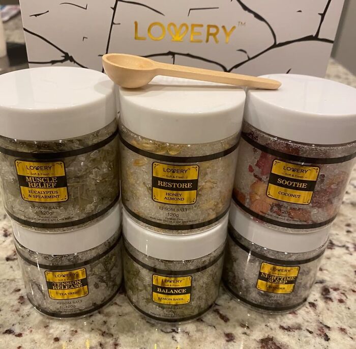 Assorted spa gift jars with scents like eucalyptus and honey almond, ideal Mother's Day gifts for a relaxing reaction.