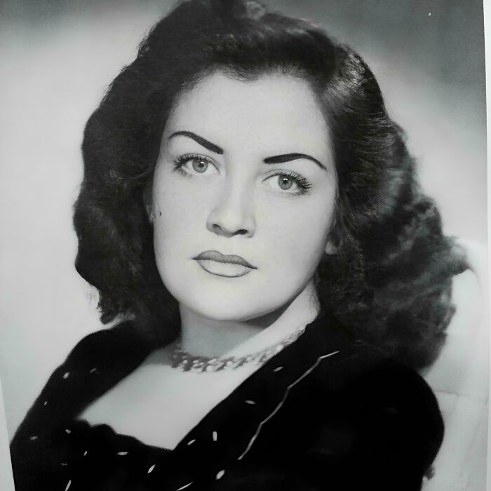 Vintage portrait of a woman with dark hair and a necklace, showcasing beautiful and interesting old pics.