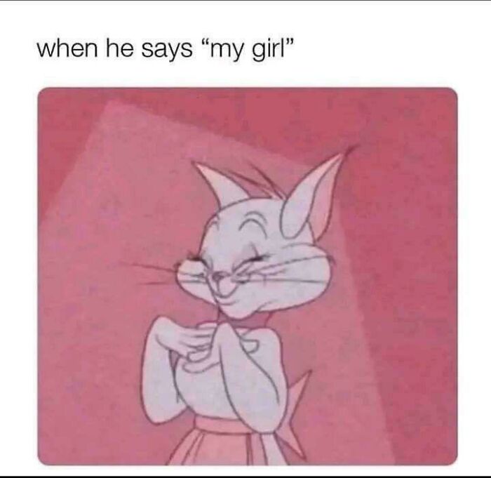 Animated cat blushing with hands clasped, feeling loved.