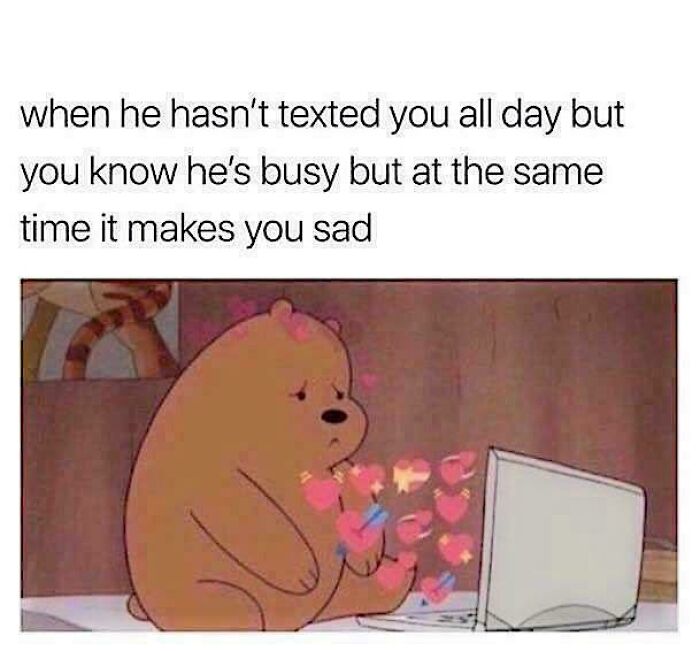 Cartoon bear feeling sad while receiving heart emojis on a laptop, illustrating a love meme sentiment.