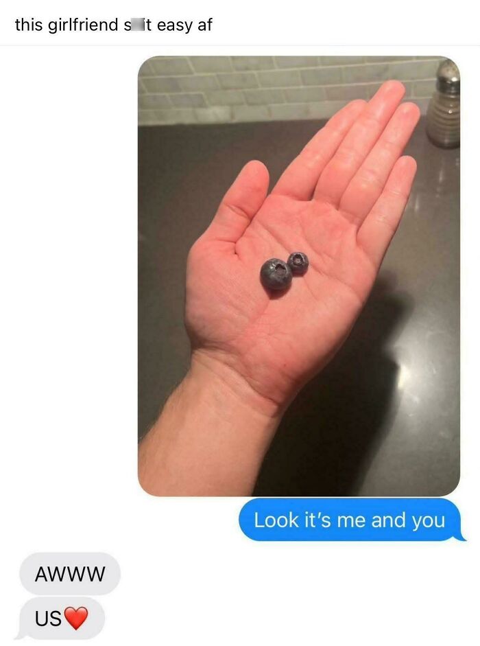 Two blueberries in hand with text, "Look it's me and you." A love meme for significant others.