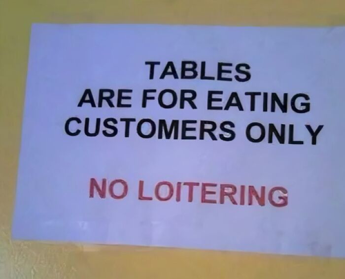 Sign stating, "Tables are for eating customers only, no loitering," demonstrating a confidently incorrect fail.