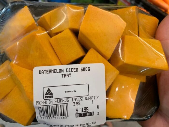 Mislabeled food package showing orange cubes as diced watermelon, showcasing a confidently incorrect fail.