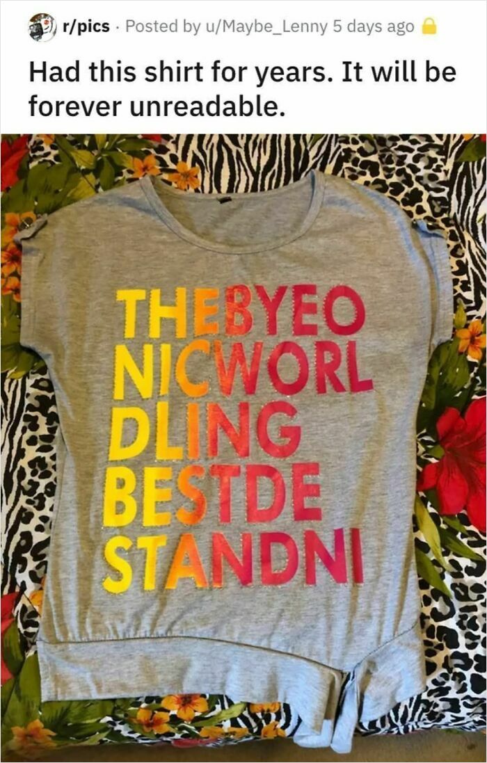 Confidently incorrect shirt text in colorful letters on a gray shirt.