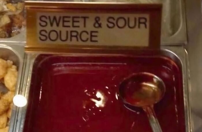 "Misspelled sweet and sour sauce label reading 'source' in a buffet setting highlighting confidently incorrect moments."
