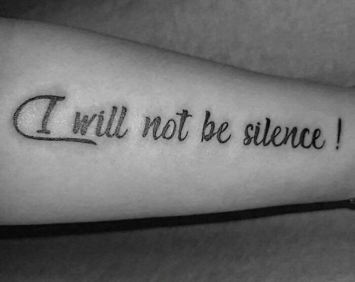 Tattoo fail spelling error on forearm reading I will not be silence in cursive script, a wild tattoo fail example.