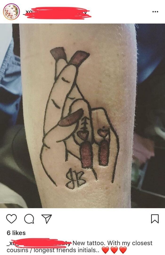 Tattoo fail of a hand with long, dark red nails and poorly drawn initials on the forearm, showing wild tattoo mistakes.