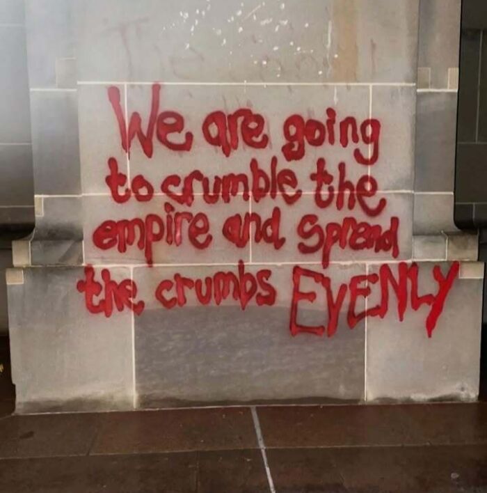 Graffiti critiquing capitalism, reads: "We are going to crumble the empire and spread the crumbs evenly."