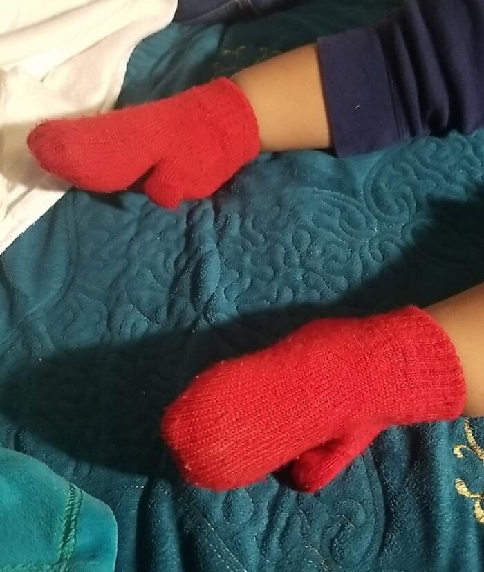 Red socks on hands instead of feet, showing a wardrobe mix-up and hinting at someone having a worse day.