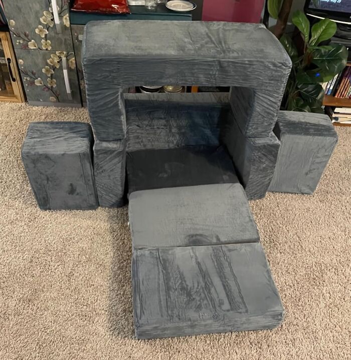 Soft gray foam blocks arranged as a play fort on carpet, showcasing popular toys kids genuinely enjoy.