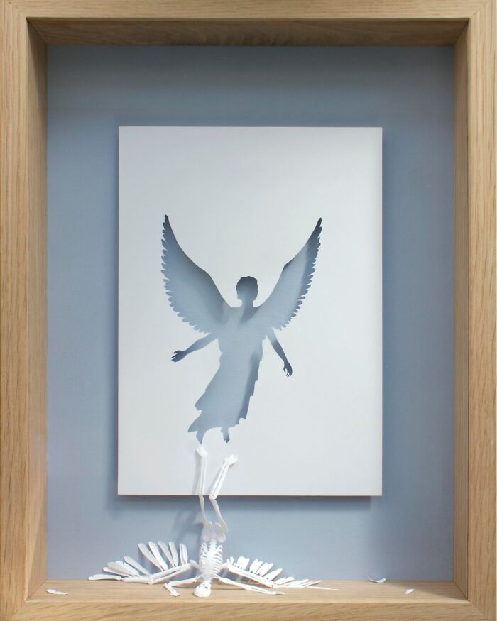 Paper art of an angel silhouette rising, created by Peter Callesen.