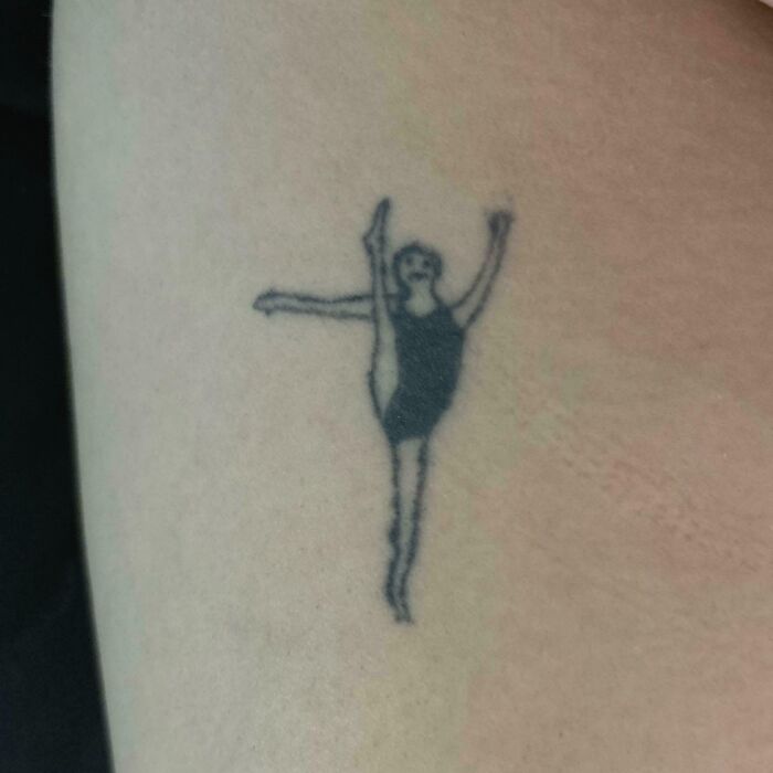 Small tattoo fail of a poorly drawn dancer on skin, showcasing one of many wild tattoo fails.