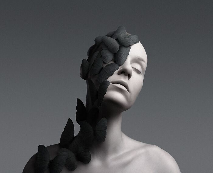 Surreal self-portrait with butterflies covering a woman's face, blending dreamlike and artistic Photoshop elements.