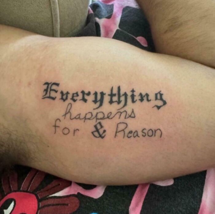 Tattoo fail with misspelled words and inconsistent fonts reading everything happens for & reason on inner arm.