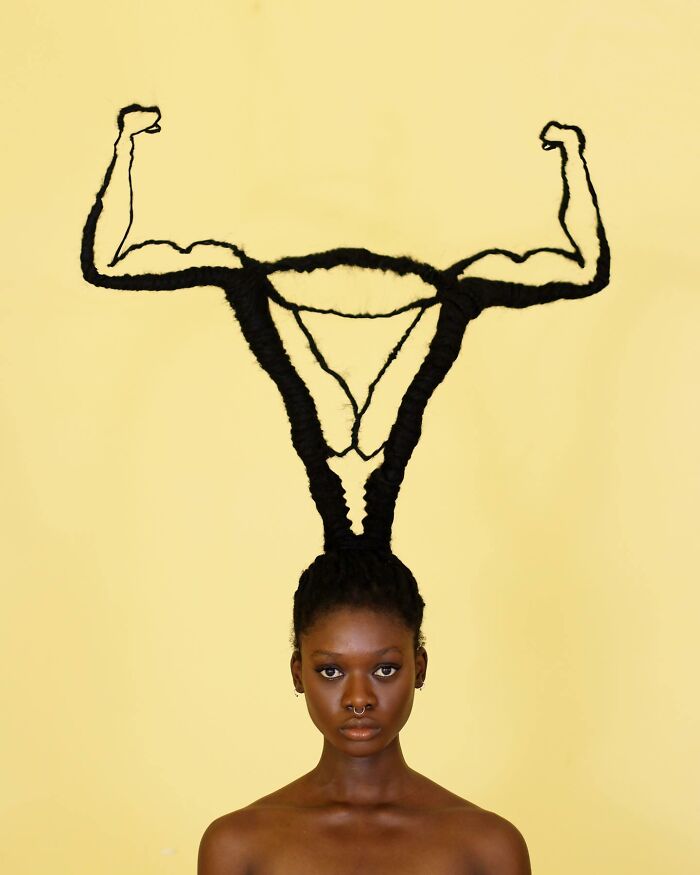 Creative hair sculpture resembling muscular arms, showcasing incredible hair artistry.
