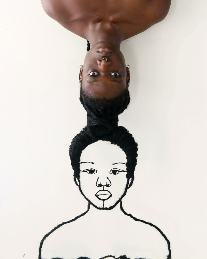 Artist creates hair sculpture resembling a drawn portrait, showcasing creative artistry with braided hair.