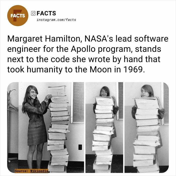 NASA engineer with Apollo program code stack, showcasing fascinating human achievement.