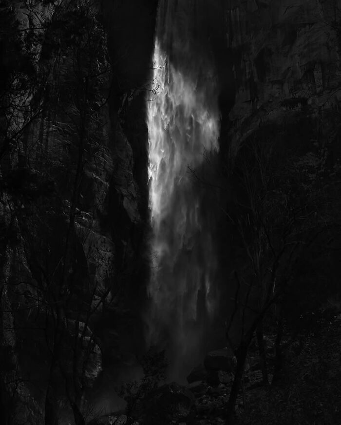 Dramatic waterfall captured in black and white, showcasing breathtaking nature photography.