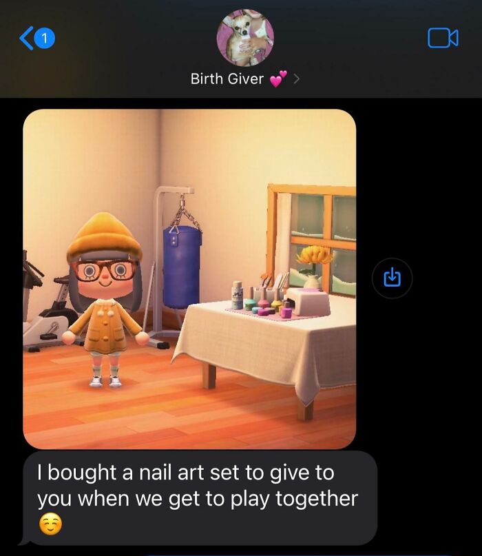 Screenshot of a game character in a cozy room with nail art set, sharing uplifting moments for daily scroll.