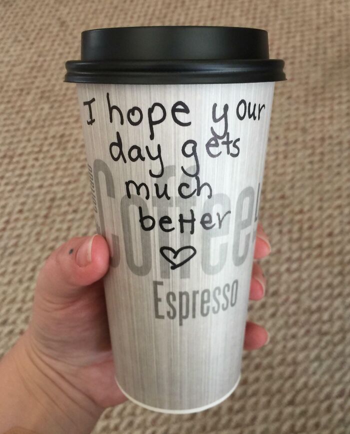 Hand holding espresso cup with uplifting message hoping your day gets much better, capturing pure and uplifting moments.