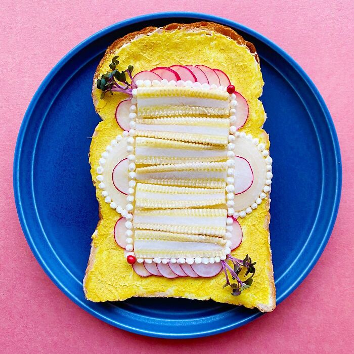Creative toast design by Japanese artist, featuring radishes and pearl-like decorations on a blue plate.