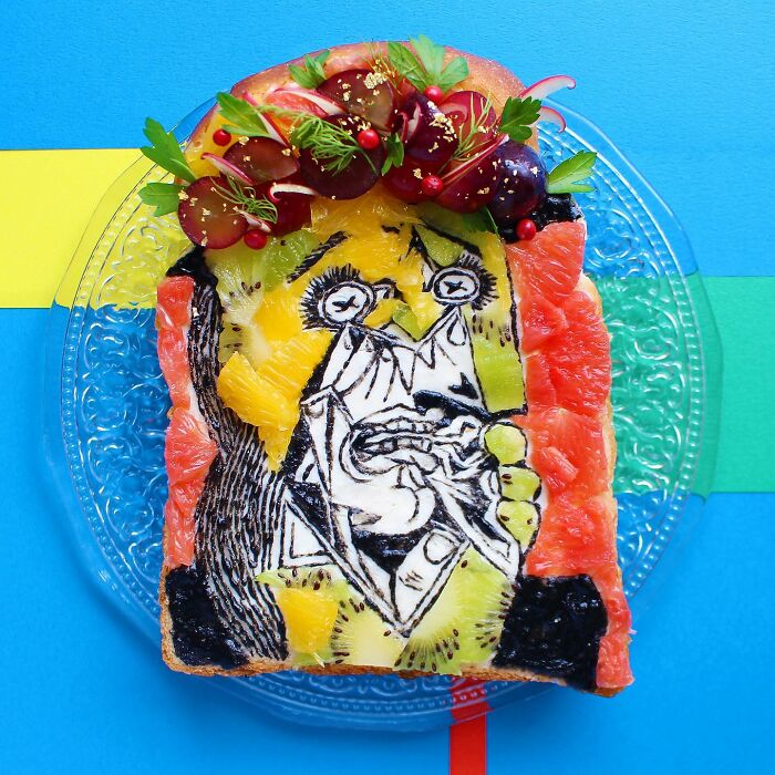 Creative toast art by Japanese artist featuring an abstract design with colorful fruit on a blue background.